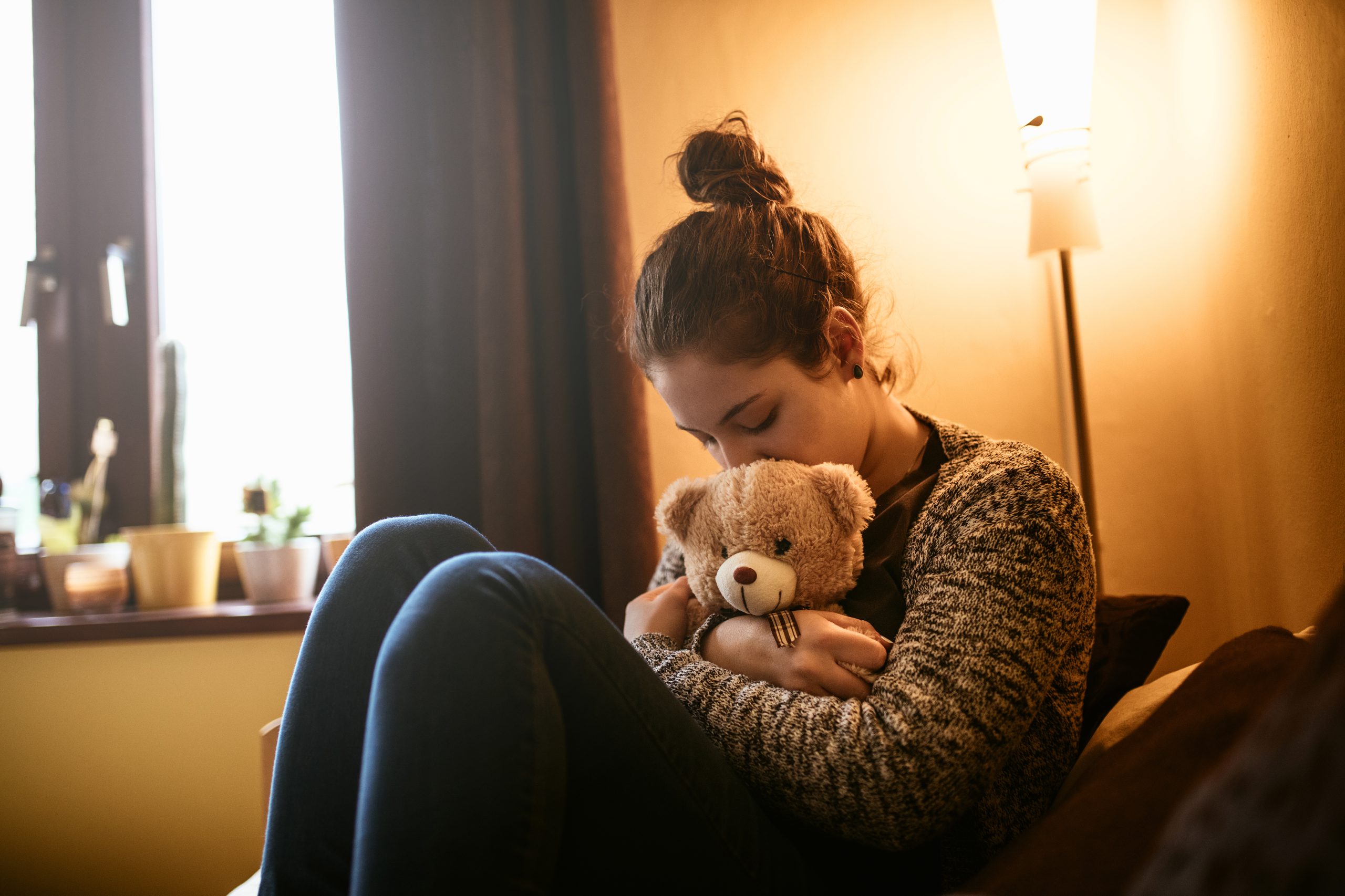 Portrait,Of,A,Sad,Teenage,Girl,Hugging,A,Teddy,Bear.